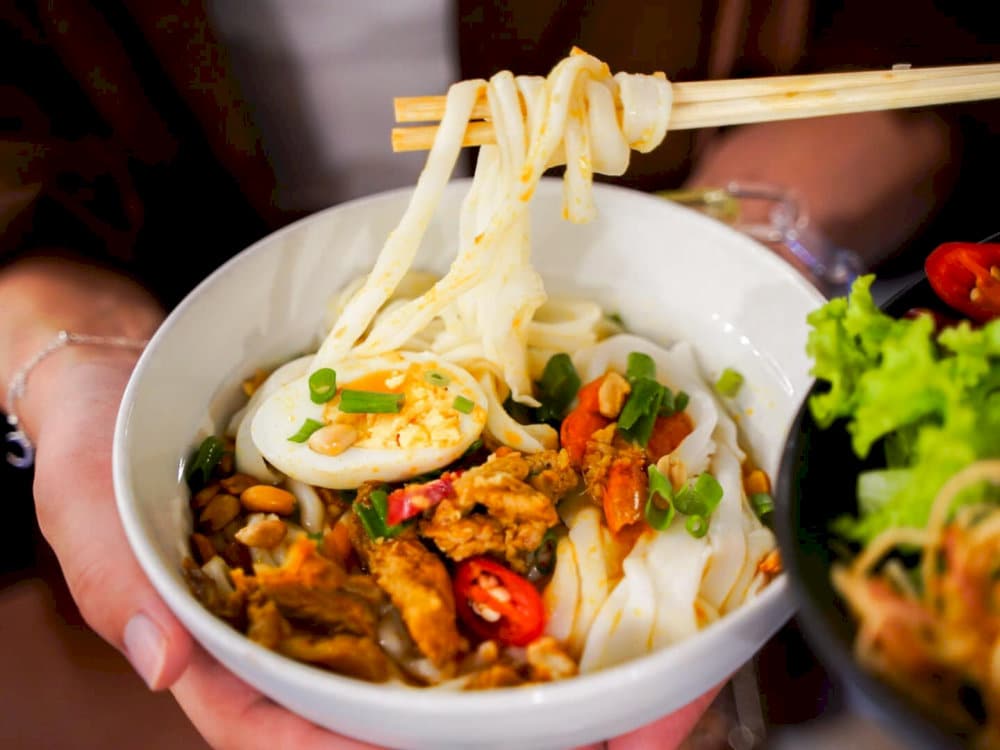 Mi Quang is freshly prepared on-site with chewy noodles, savory broth, and a variety of tempting toppings